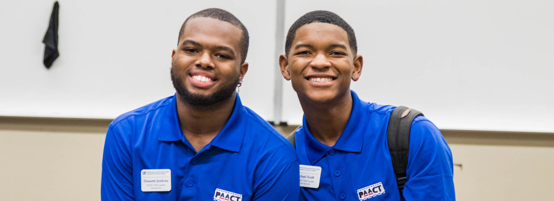 two PaaCT student staff members smiling and looking at the camera